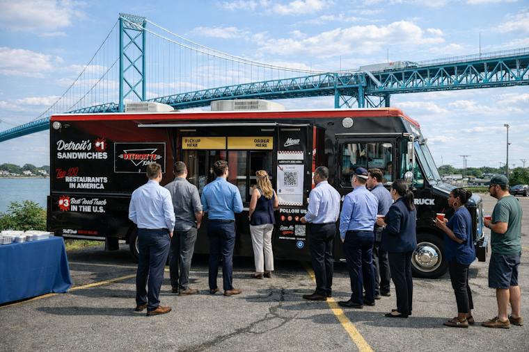 The Detroit 75 Kitchen food truck serving at an event