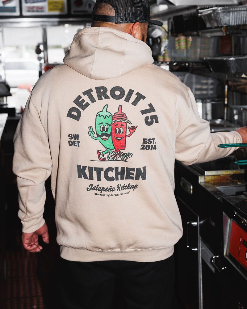 The Detroit 75 Kitchen Jalape&ntilde;o Ketchup hoodie, worn on the line in the kitchen